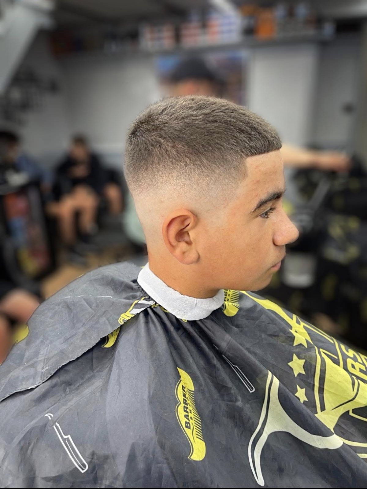 Clean high skin fade with a sharp line up, cut at Cygneture Barbers