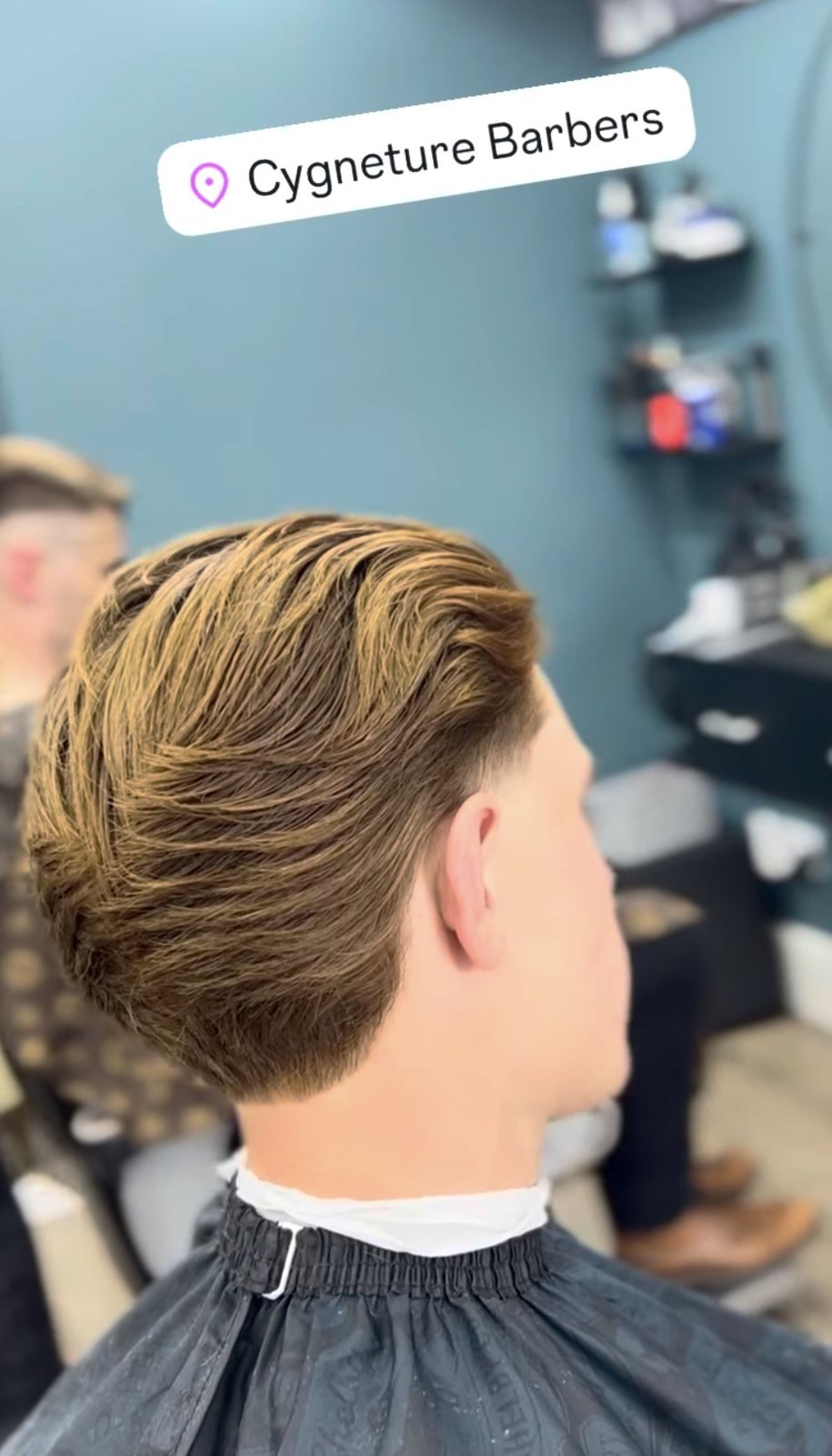 Longer flowing hair with a tapered neckline in the shop