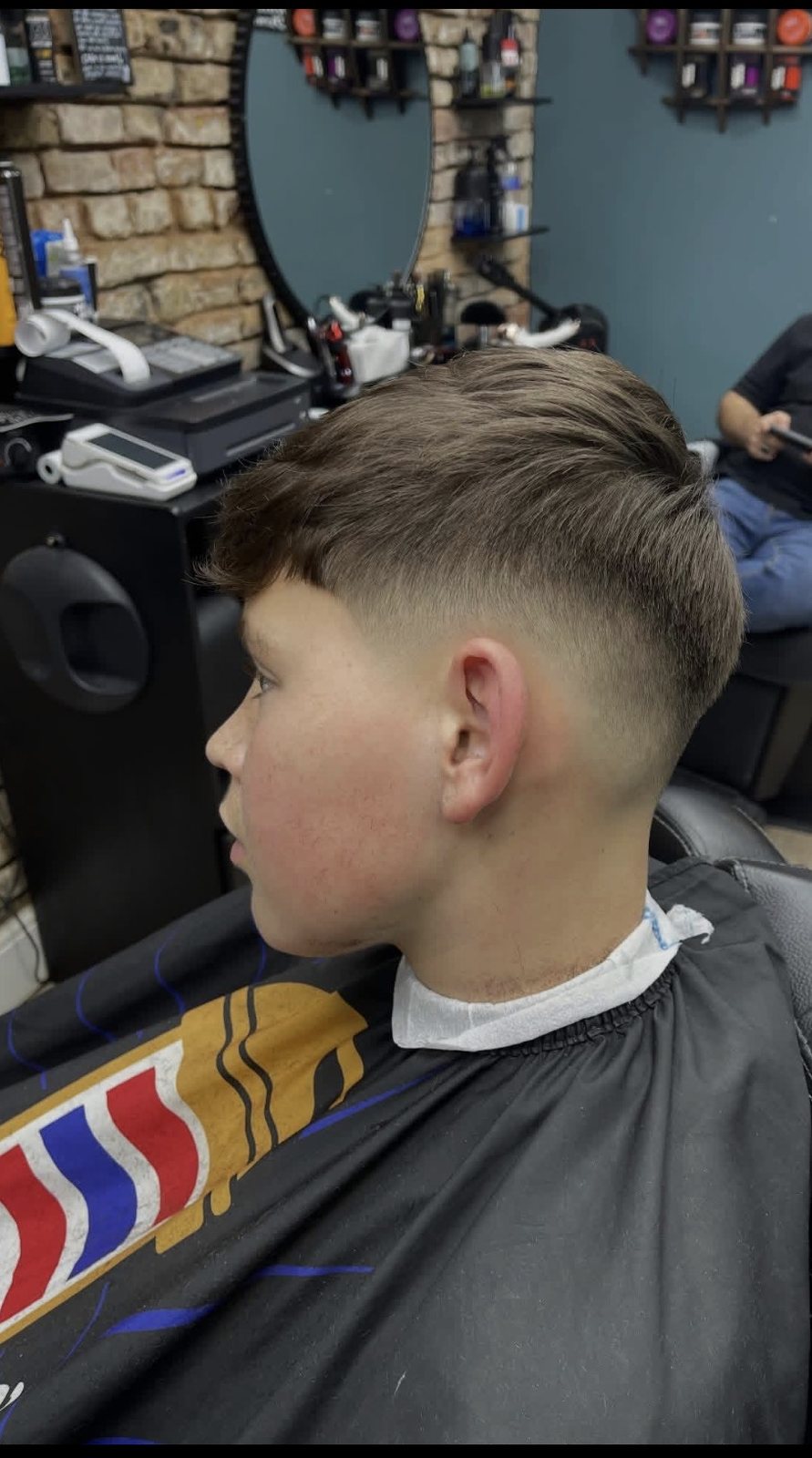 Drop fade finished in front of the mirrors inside Cygneture Barbers