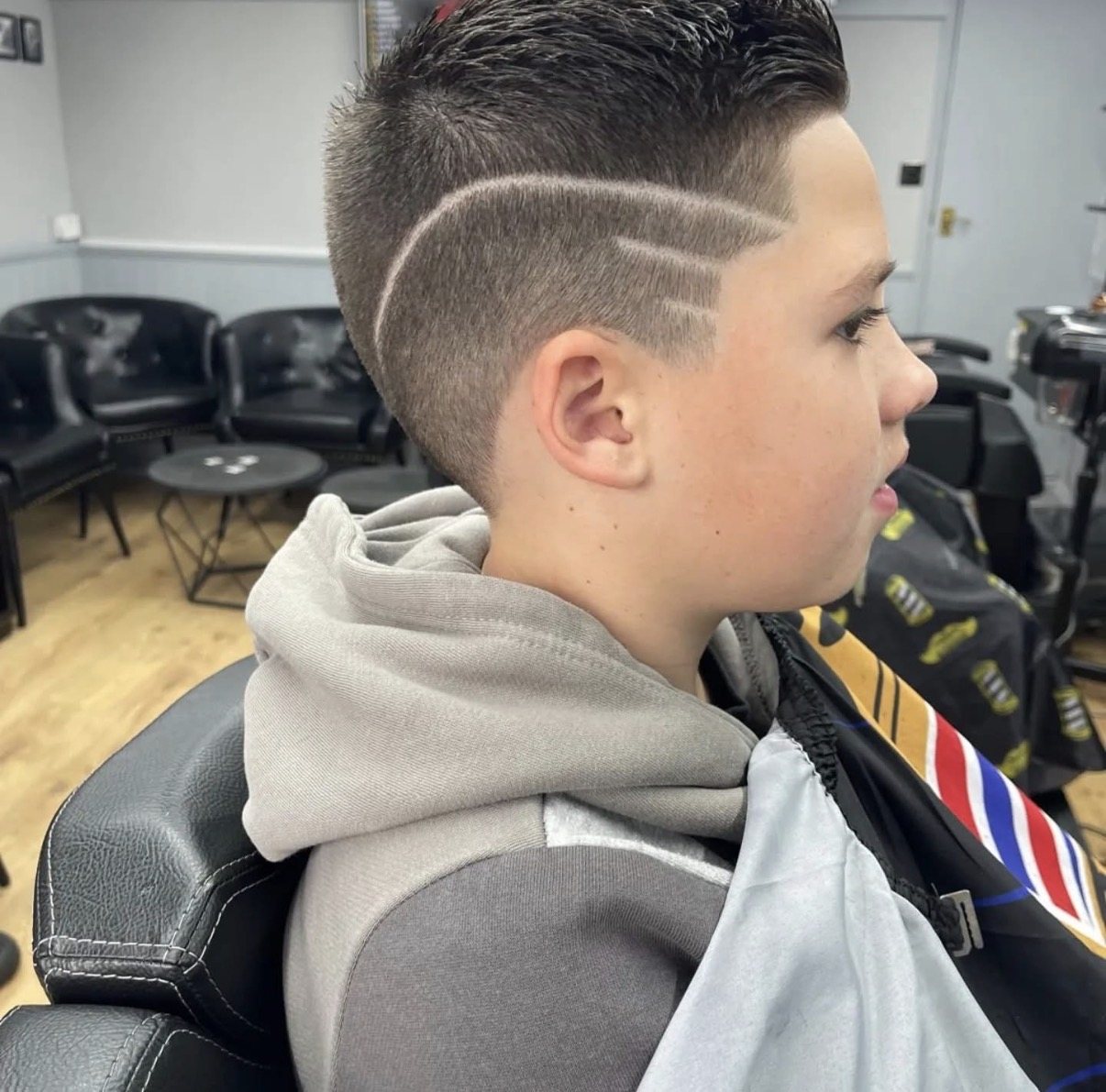 Razor design detail cut into a faded short back and sides