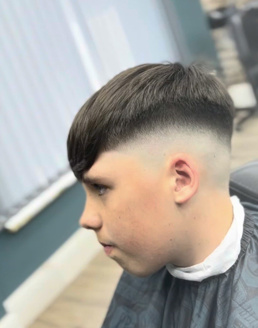 Blunt fringe with a high skin fade